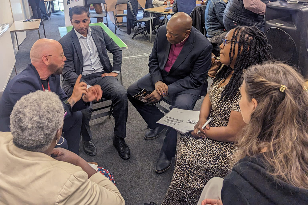 Another small group talking at the Synergy Network meeting